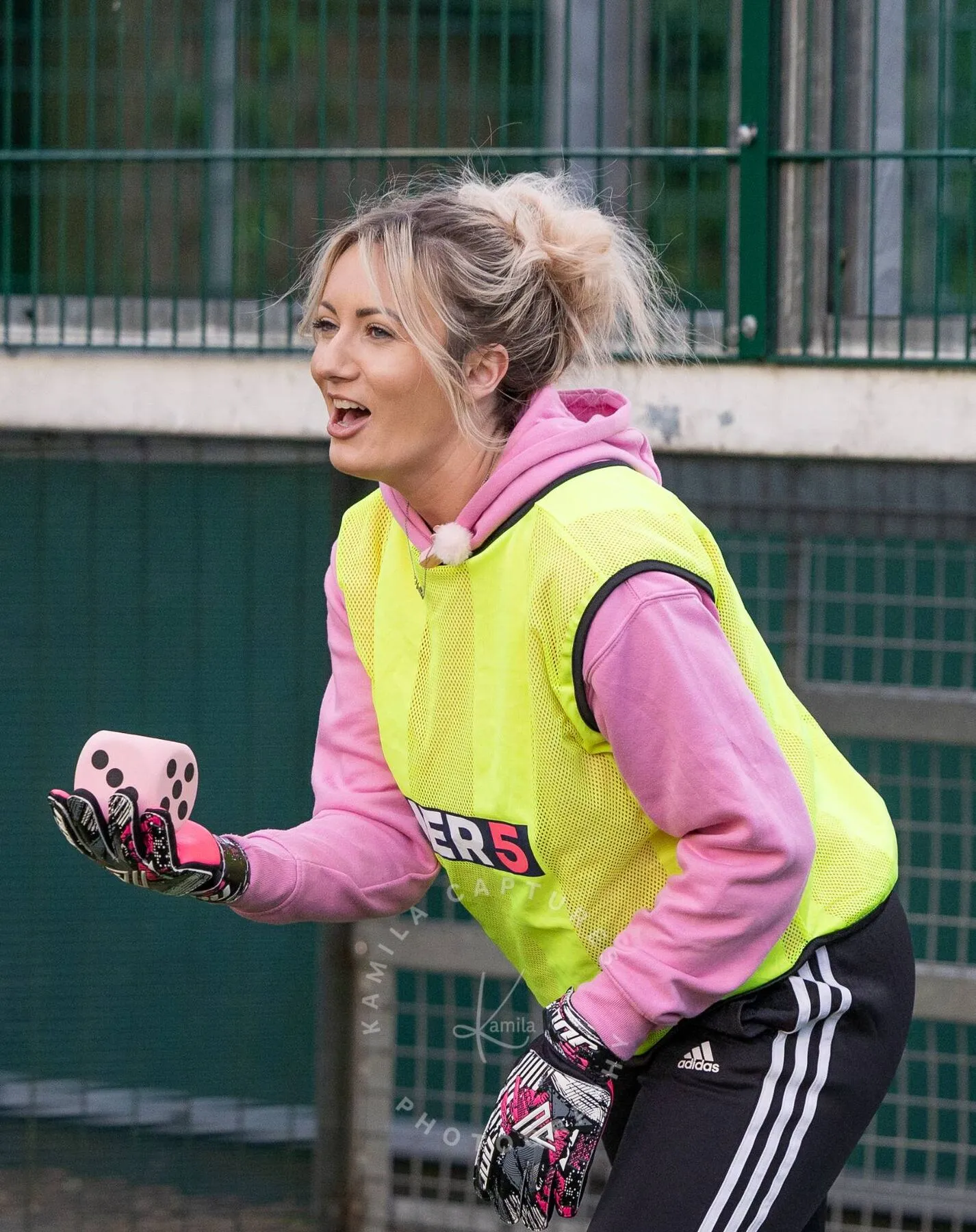 A HER5 player smiling on the pitch